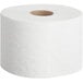 A Tork Universal mid-size toilet paper roll on a white background.