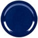 A blue Carlisle Dallas Ware melamine plate with a speckled surface.