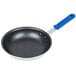 A Vollrath Wear-Ever frying pan with a blue Cool Handle.