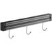 A black and silver metal Choice knife holder strip with three hooks.