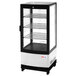 A black and silver Turbo Air Countertop Glass Door Refrigerator with glass shelves inside.