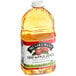 A bottle of Musselman's 100% apple juice on a white background.