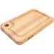A John Boos maple wood cutting board with a handle.
