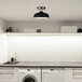 A white kitchen with a Canarm Bello semi-flush mount light in black and brushed nickel.