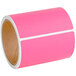A roll of Lavex pink thermal transfer labels with white stripes.