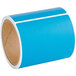 A roll of blue labels with a white border.