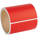 A roll of red Lavex thermal transfer labels.