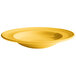 A yellow Tuxton soup/pasta bowl with a swirl design.