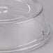 A clear plastic Cambro plate cover with a circular hole.