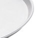 An American Metalcraft aluminum pizza pan on a white surface.