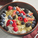 A bowl of yogurt with fruit and Bob's Red Mill Gluten-Free Hulled Hemp Seed Hearts.