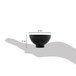A hand holding a black Fineline Tiny Temptations bowl.