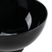 A close up of a black Fineline Tiny Temptations bowl.