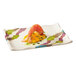 A white rectangular melamine plate with wavy edges and a shrimp on it.
