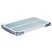 A MetroMax metal grid shelf with a blue and grey removable mat.