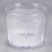 A Carlisle clear plastic tumbler with a ribbed bottom.