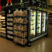 A Marco Company double-sided refrigerator end cap merchandising display with food on it.