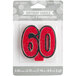 A red glitter birthday candle shaped like the number 60 with black accents.