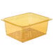 A Cambro amber plastic colander pan with holes in it.