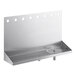 A Regency stainless steel wall mount drip tray with rinser and 8 faucet holes.
