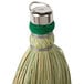 A close-up of a Heavy-Duty Authentic Amish-Made Corn Whisk Broom with a green handle.
