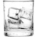A glass of water with Scotsman medium ice cubes.