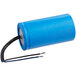 An Avantco running capacitor with blue cylindrical casing and black and white wires.