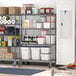 A Metro gray wire shelving unit with food items on it.