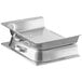 A close-up of a stainless steel hinged chafer cover over a metal tray.