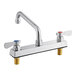 A silver Regency deck-mounted faucet with red and blue knobs.