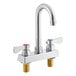 A chrome Regency deck-mounted faucet with silver and red and blue handles.