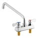 A chrome Regency deck-mounted faucet with two silver handles and a 12" swing spout.