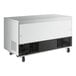 A white Avantco undercounter freezer with black and grey accents and wheels.