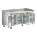 An Avantco stainless steel refrigerated pizza prep table with three doors and a stone top.