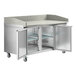 An Avantco stainless steel stone top counter with two doors.