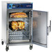 An Alto-Shaam stackable cook and hold oven with chicken inside.