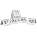 A group of Tablecraft stainless steel cut-out numbers on a white surface.