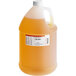 A white jug of LorAnn Oils Cake Batter Super Strength Flavoring with orange liquid.