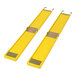 Two yellow plastic mats with metal handles.