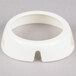 A white plastic Tablecraft salad dressing dispenser collar with beige lettering and a hole in it.