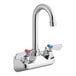 A silver Regency wall mount faucet with two red and blue knobs.