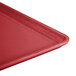 A close-up of a red Cambro dietary tray.