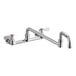 A chrome and silver Regency wall mount faucet with double-jointed spout and two knobs.
