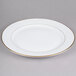 A CAC Golden Royal bright white porcelain plate with a gold trim.