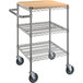 A Regency chrome utility cart with three shelves, wheels, and a wooden insert on the top shelf.