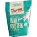 A white bag of Bob's Red Mill Whey Protein Powder.