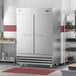 A Main Street Equipment BMR-49-F reach-in freezer with two solid doors in a stainless steel kitchen.