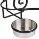 A stainless steel bowl with a metal stand for American Metalcraft chafer spoon holder.