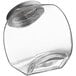 A clear glass penny candy jar with a chrome lid.