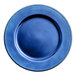 A round royal blue plastic charger plate with beaded rim design.
